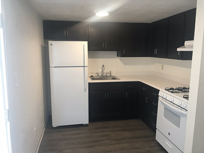 Apartment Kitchen with Wood Style Flooring | Meadows Holly