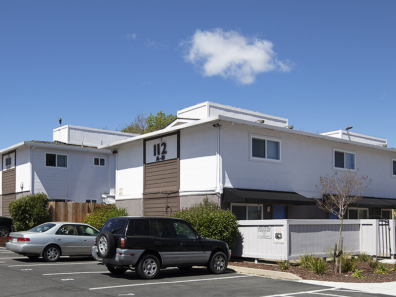 Exterior View of Apartment Complex with Parking | Meadows Holly