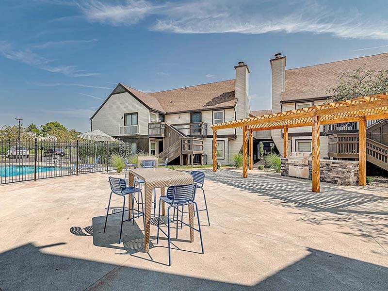 Apartment Complex with Outdoor Seating and View of Outdoor Pool | Avia Lofts at Founders Road