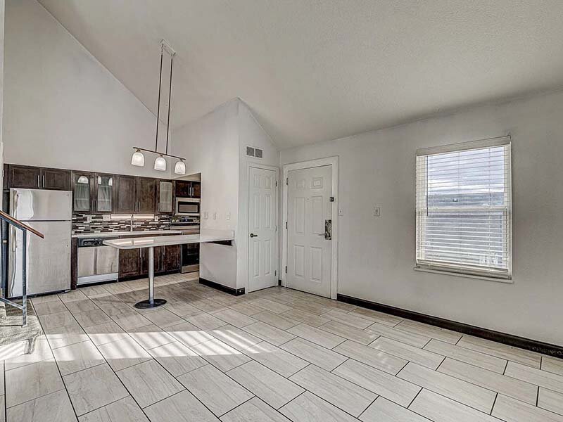Kitchen with View of Window and Tile Style Flooring | Avia Lofts at Founders Road