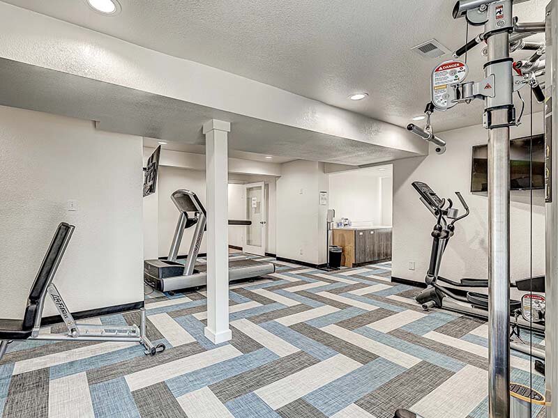 Community Gym with View of Treadmill and Televisions | Avia Lofts at Founders Road