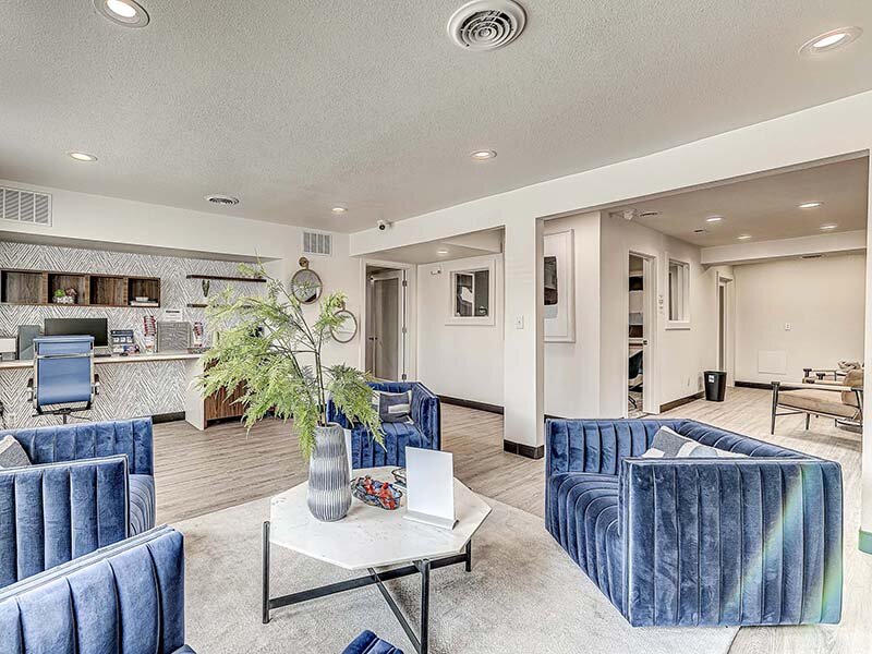 Community Clubhouse Seating with Table and View of Coffee Bar | Avia Lofts at Founders Road