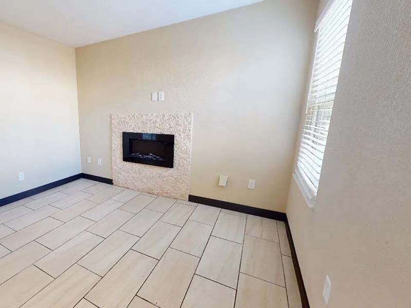Living Room with Tile Style Flooring and Fireplace | Avia Lofts at Founders Road