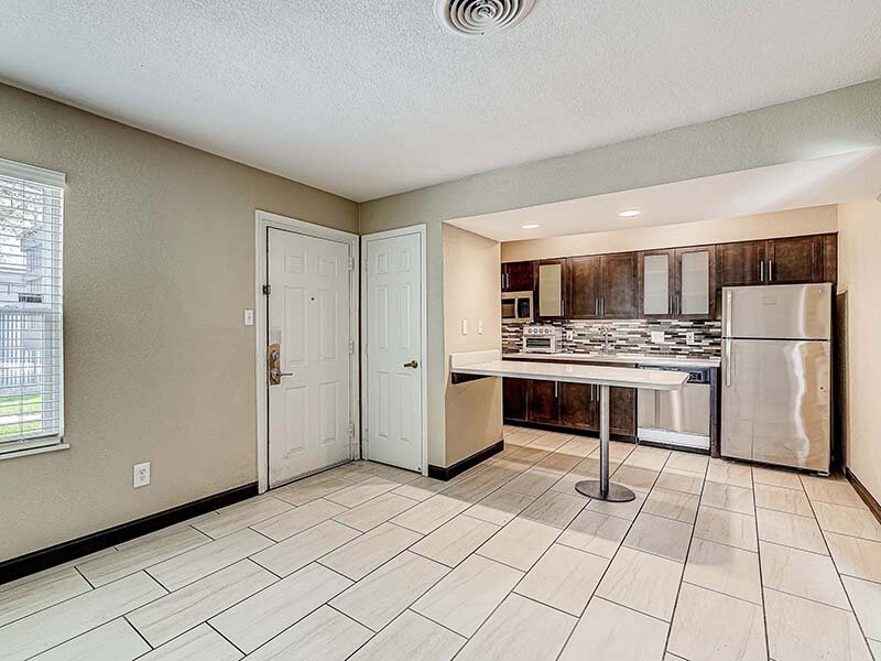 Apartment Kitchen with View of Table and Appliances | Avia Lofts at Founders Road