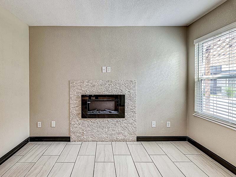 Living Room with View of Fireplace and Window | Avia Lofts at Founders Road