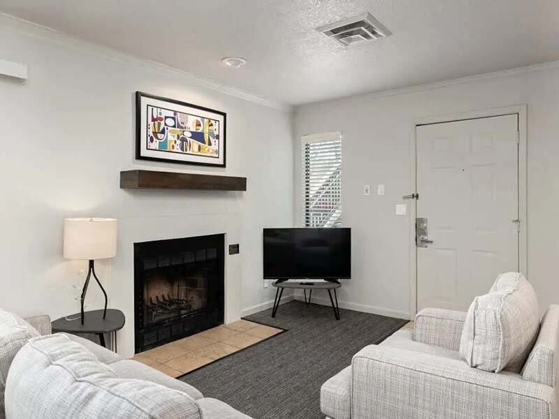 Living Room with Fireplace and Television | Avia at 110th St