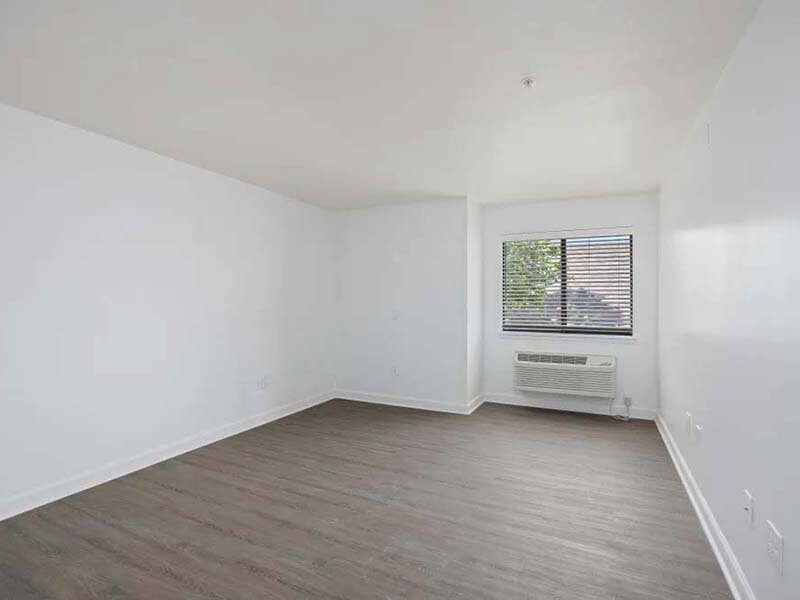 Bedroom with Window and Wood Style Flooring | Avia on College Boulevard