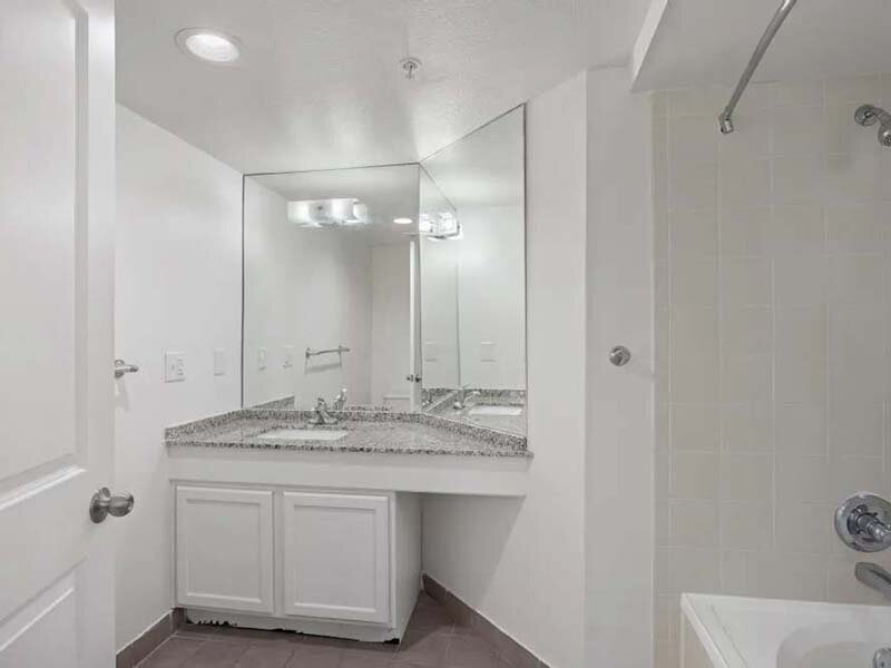 Bathroom with Ceiling Lights and Sink | Avia on College Boulevard