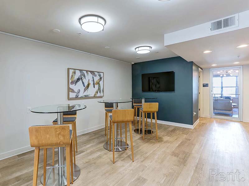 Community Seating with Tables and Television | Avia Lofts at North Shore