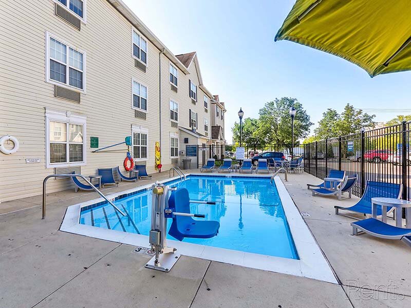 Community Outdoor Pool with Patio Umbrella | Avia Lofts at North Shore