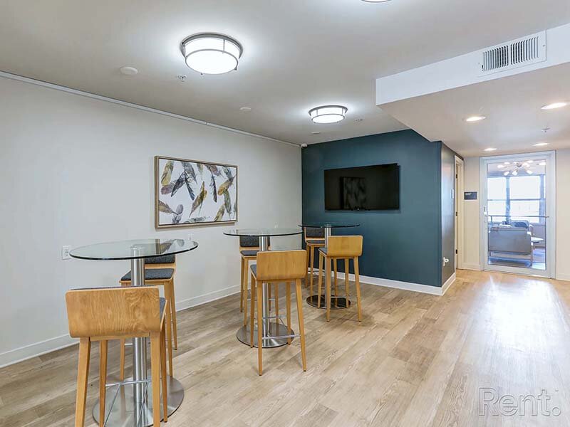 Community Seating with Ceiling Lights and Wall Art | Avia Lofts at North Shore