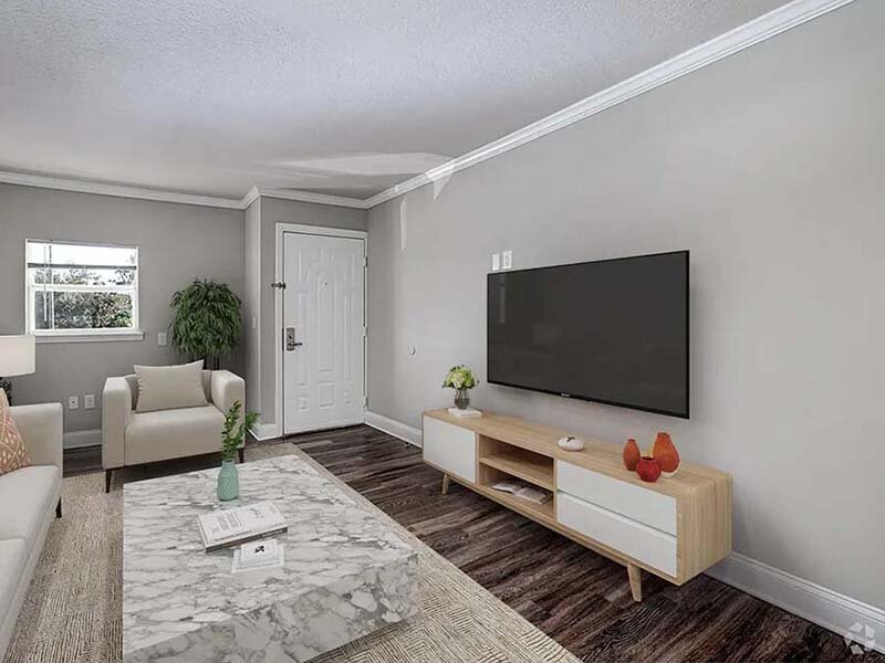 Bedroom with Television and Wood Styled Flooring | Avia At Reedy Creek