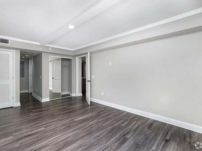Bedroom with Open Closet and Wood Style Flooring | Avia At Reedy Creek