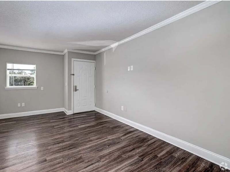 View of Apartment Entrance with Wood Style Flooring | Avia At Reedy Creek