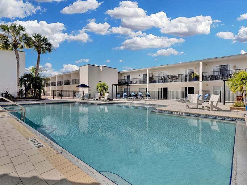 Exterior Swimming Pool with View of Apartment Complex | Avia At Reedy Creek