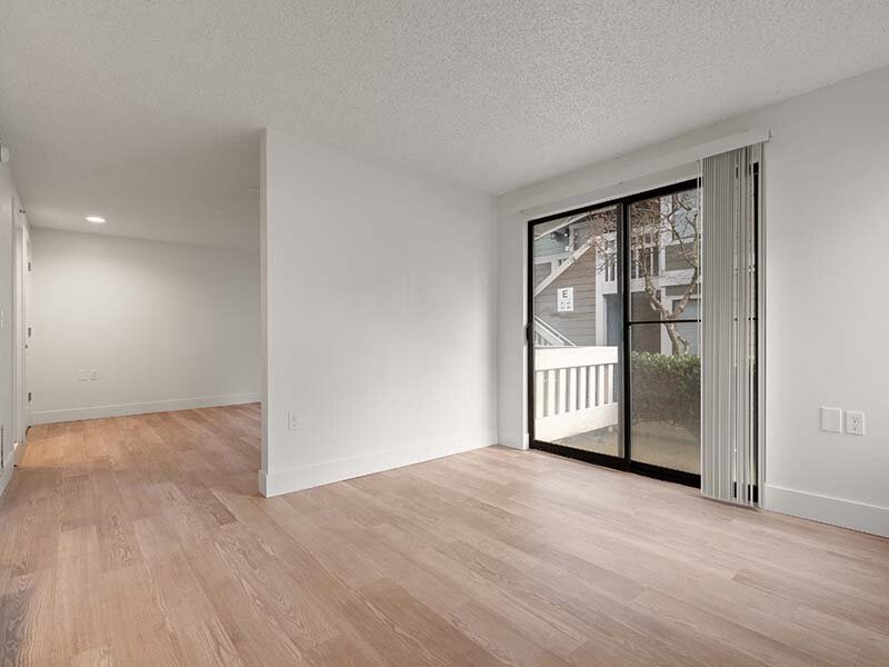 Living Room Area with Views of Patio and Wood Style Flooring | Avia Lofts on Parkway