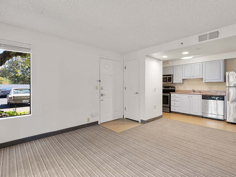 Apartment Entryway with Views of Kitchen and Wood Style Flooring | Avia Lofts on Parkway