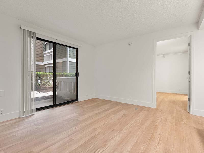 Patio Entrance with Wood Style Flooring and Views of Hallway | Avia Lofts on Parkway