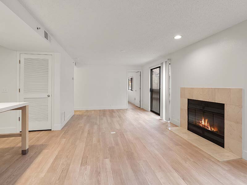 Living Room with Fireplace and Wood Style Flooring | Avia Lofts on Parkway