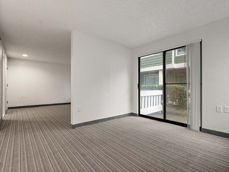 Entrance to Patio with View of Living Room with Wood Style Flooring | Avia Lofts on Parkway