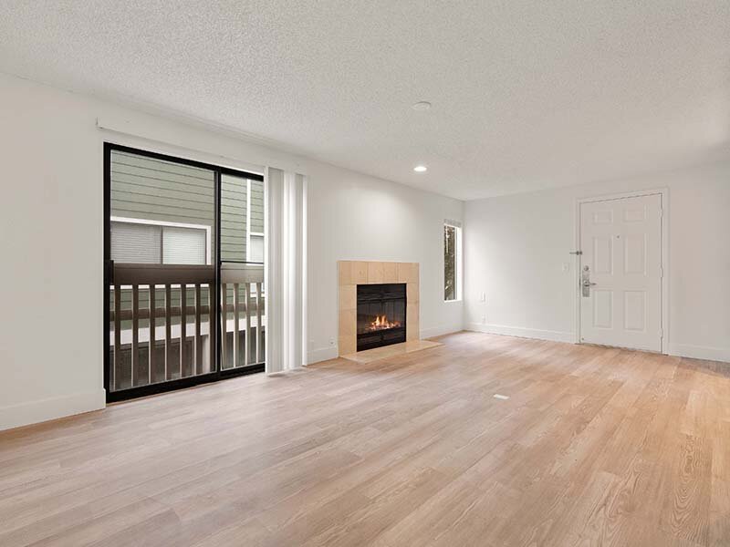 Living Room with Window and View of Fireplace with Wood Style Flooring | Avia Lofts on Parkway