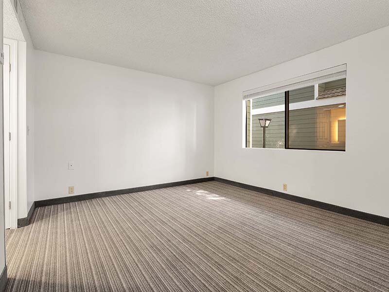 Bedroom with Wood Style Flooring and Window | Avia Lofts on Parkway