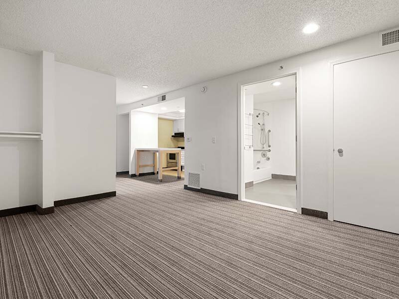 Living Room with Views of Kitchen and Hallway | Avia Lofts on Parkway