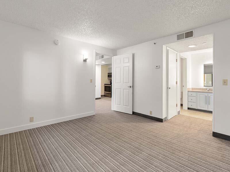 Apartment Hallway with Wood Style Flooring and Ceiling Lights | Avia Lofts on Parkway