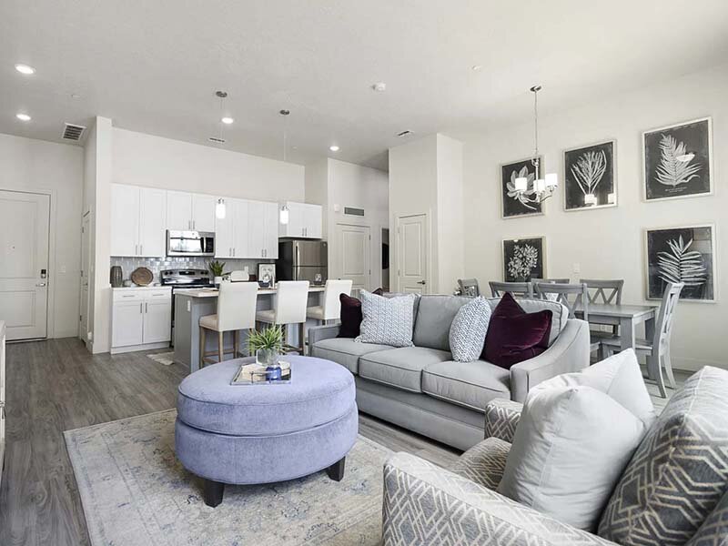 Apartment Interior Living Room with Carpeted Flooring and Wall Art | 200 City View