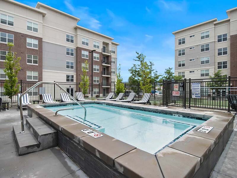 Outdoor Swimming Pool with Views of Apartment Complex | 200 City View