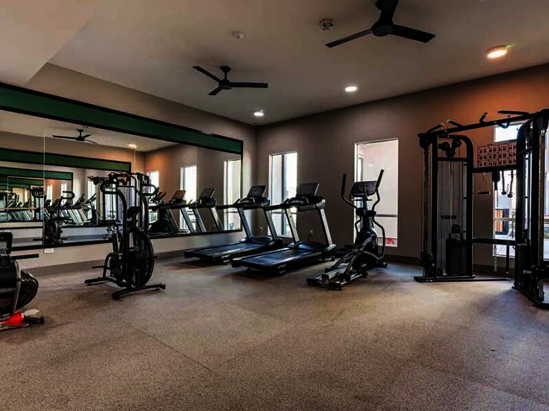 Exercise Room with Treadmills and Ceiling Fan | Monamos Terrace