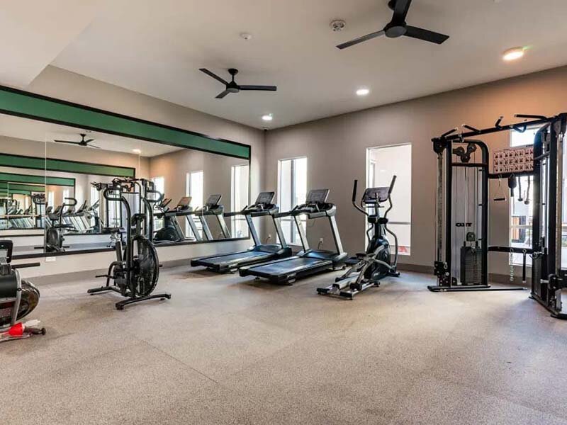 Exercise Room with Treadmills and Ceiling Fan | Monamos Terrace