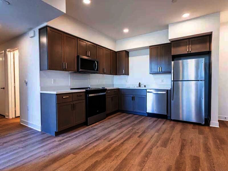 Interior Apartment Kitchen Area with Wood Style Flooring | Monamos Terrace