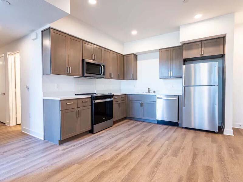 Interior Apartment Kitchen Area with Wood Style Flooring | Monamos Terrace