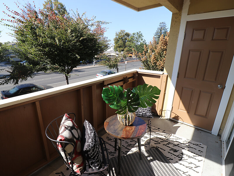 Apartment Exterior Patio View with Seating and Table | Pentagon