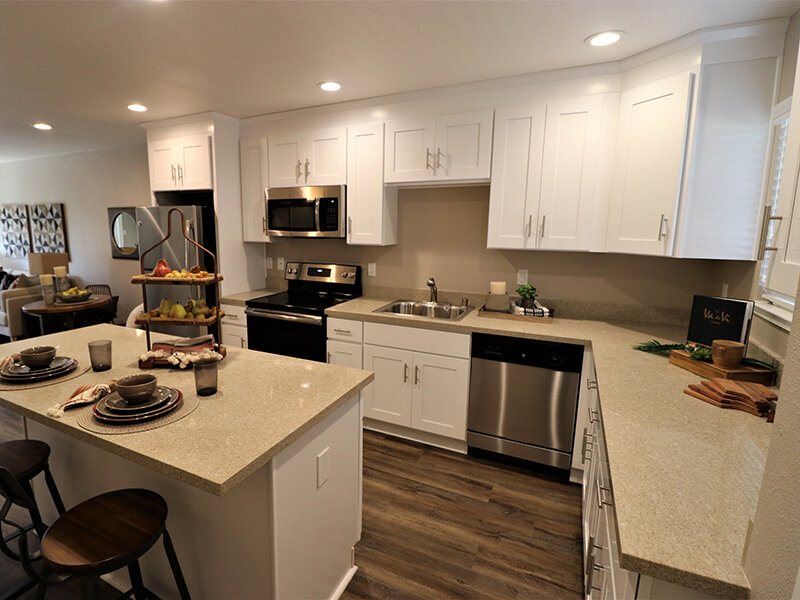 Apartment Kitchen with Wood Style Flooring and Cabinets | Pentagon