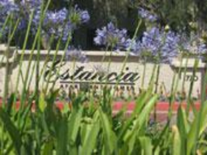View of Sign Through Grass | Estancia Apartments in Ontario, Ca