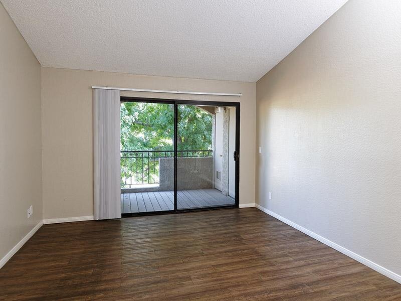 Living Room and Balcony | Estancia Apartments in Ontario, Ca