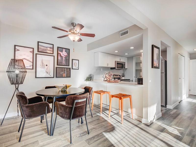 Apartments for Rent in Cottonwood Heights UT - Santa Fe at Cottonwood - Upscale Dining Room With Four Chairs, a Circular Table, and a Ceiling Fan