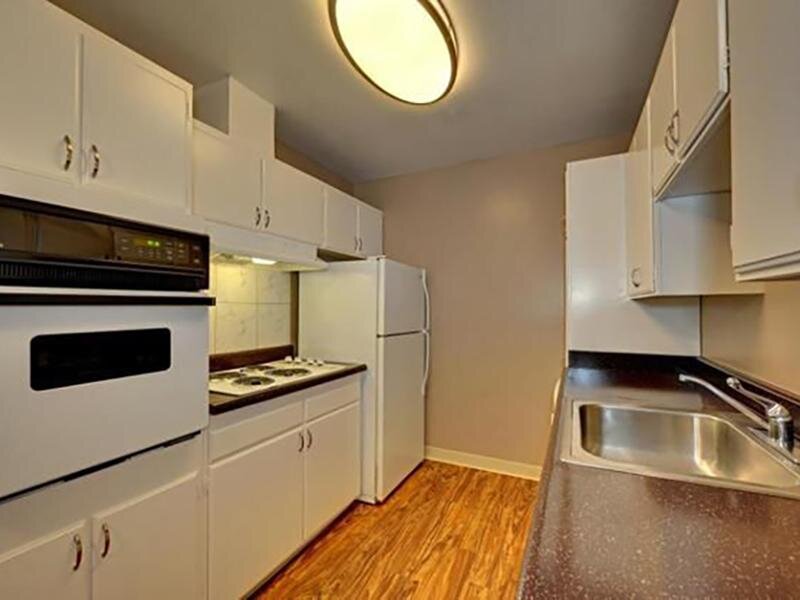 Kitchen with White Appliances | Woodside Place