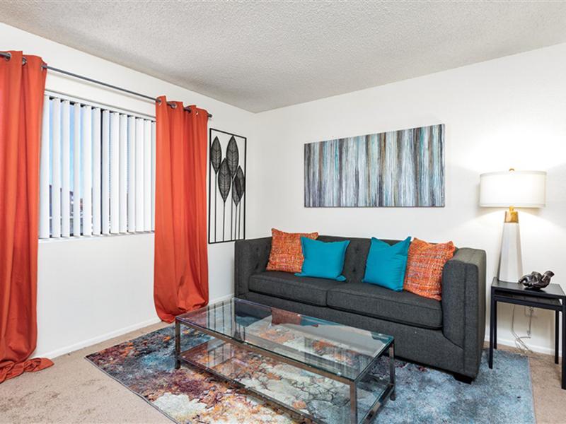 Carpeted Living Room | Portola West McDowell Apartments in Phoenix, AZ