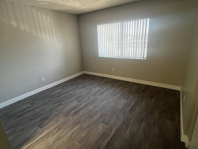 Master Bedroom with Window and Wood Styled Flooring | Seventeen 805