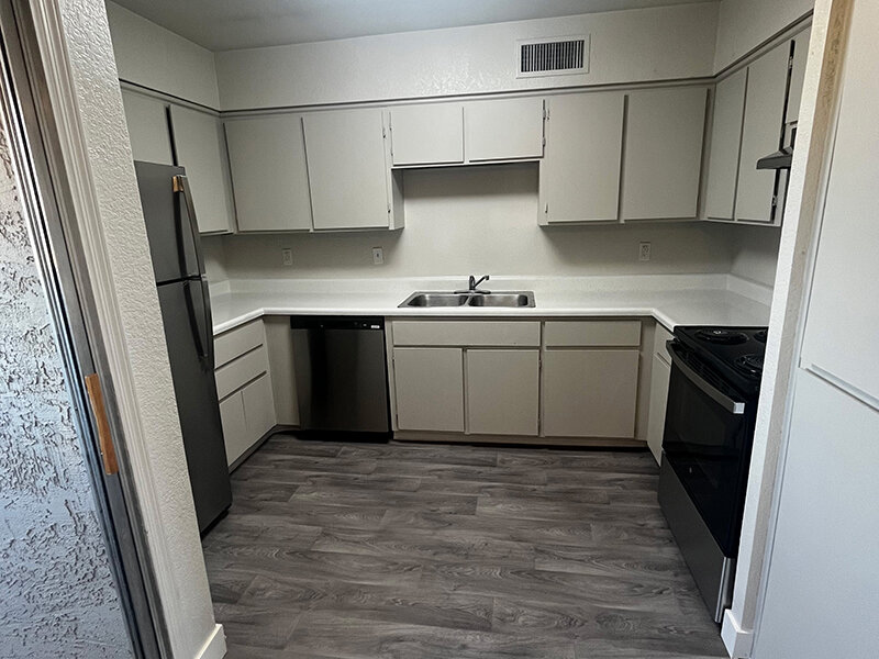 Kitchen with Appliances and Wood Styled Flooring | Seventeen 805