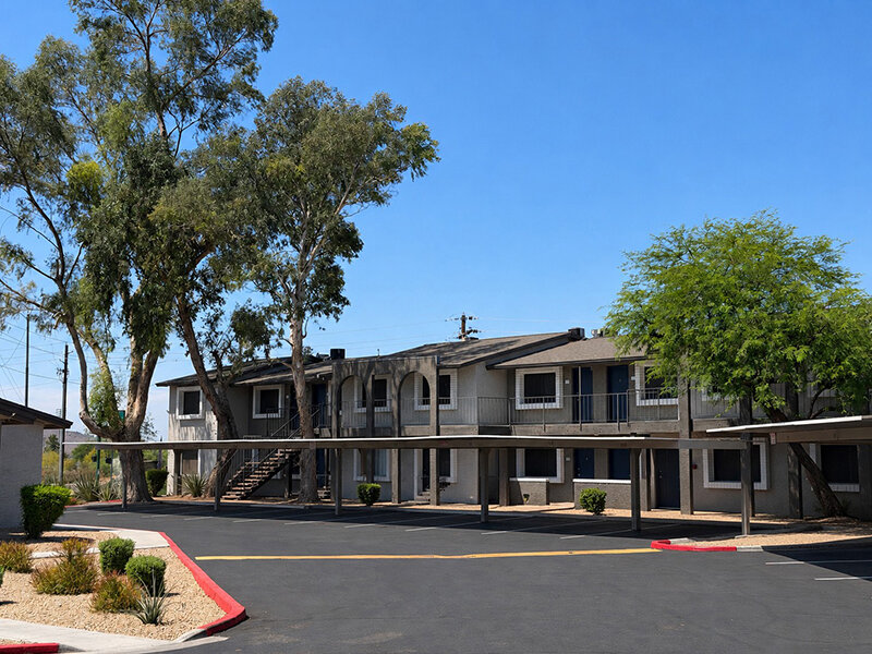 Apartment Complex with Covered Parking and Foliage | Seventeen 805