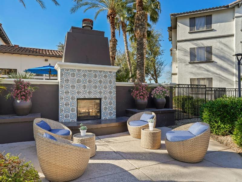 Outdoor Lounge with Fireplace | Serafina Apartments
