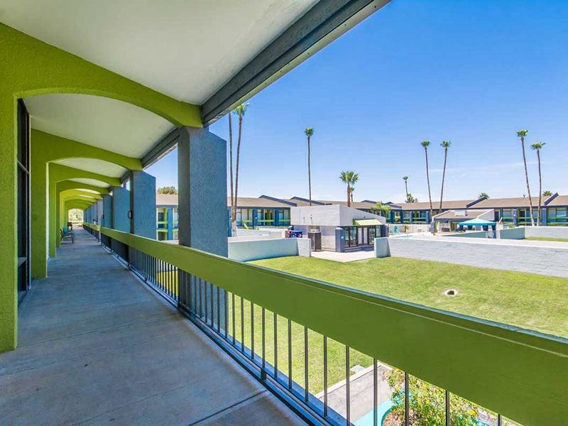 Phoenix AZ Apartments - Portola Biltmore - Oversized Balcony with Bright Green Railing, Pool and Courtyard Views