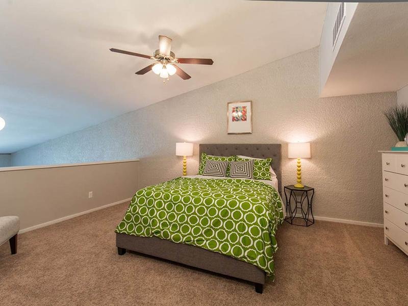 2 BR Apartments in Phoenix AZ - Portola Biltmore - Loft Bedroom with Carpeted Flooring, Ceiling Fan, and Queen Bed