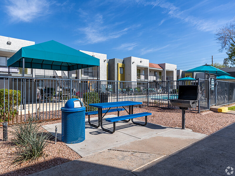 Outdoor Picnic Bench with Views to the Outdoor Apartment Pool | Emerson Square
