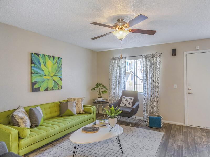 Living Room with a Ceiling Fan | Emerson Square Apartments in Tempe, AZ