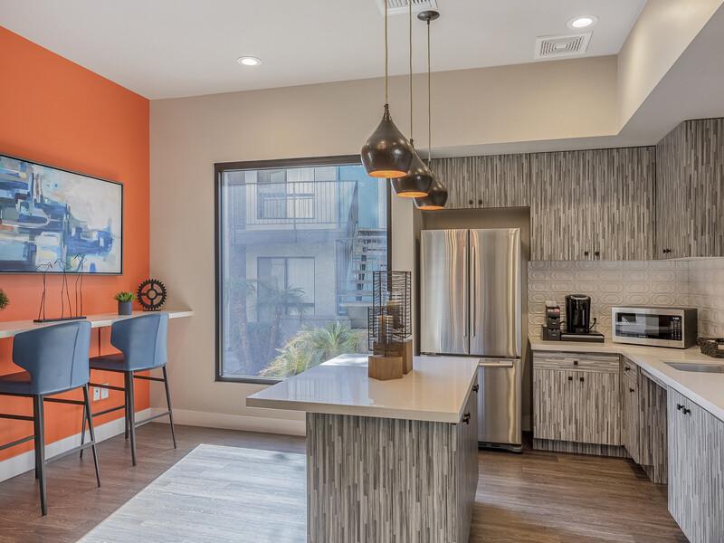Clubhouse Kitchen and Seating | Emerson Square Apartments in Tempe, AZ
